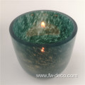 green patterned glass candle holder